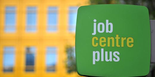 Pound dips from year high on weak pay growth